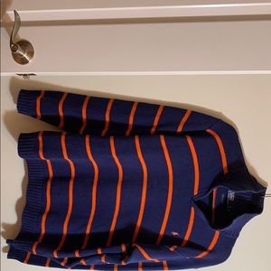 Polo sweater. Navy with orange horizontal stripes.